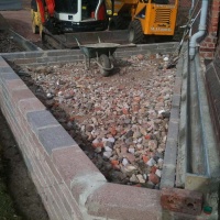 Ground bearing slab compacted hardcore layer